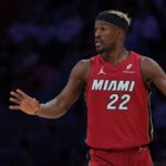 Miami Heat forward Jimmy Butler (22) reacts against the Portland Trail Blazers during the third quarter at Kaseya Center.