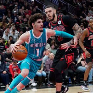Chicago Bulls guard Lonzo Ball (2) defends Charlotte Hornets guard LaMelo Ball (1) during the second half at United Center.