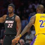 Miami Heat forward Jimmy Butler (22) looks to pass against Los Angeles Lakers forward LeBron James (23) in the first half at Kaseya Center.