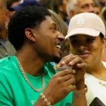 Washington Wizards forward Bradley Beal (L) talks with wife Kamiah Adams-Beal (R) while sitting in the player's box of Frances Tiafoe (USA) (not pictured) during the match against Carlos Alcaraz (ESP) (not pictured) in a men's singles semifinal on day twelve of the 2022 U.S. Open tennis tournament at USTA Billie Jean King Tennis Center