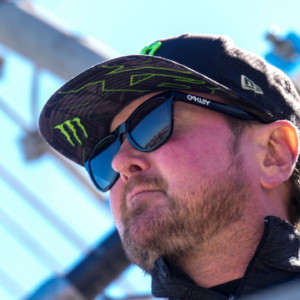 Oct 8, 2023; Concord, North Carolina, USA; dFormer NASCAR driver Kurt Busch on the flag stand as the honorary starter during the Bank of America Roval 400 at Charlotte Motor Speedway Road Course. Mandatory Credit: Jim Dedmon-Imagn Images