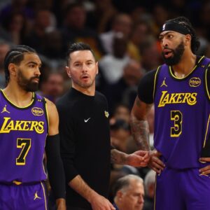 Los Angeles Lakers head coach JJ Redick with guard Gabe Vincent (7) and forward Anthony Davis (3) against the Phoenix Suns at Footprint Center