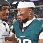 Washington Commanders quarterback Jayden Daniels (5) and Philadelphia Eagles running back Saquon Barkley (26) meet on the field after the game at Lincoln Financial Field.