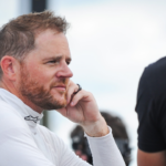 Justin Marks talks with a crew member after Trans Am practice Friday, July 7, 2023, at Road America in Elkhart Lake, Wisconsin.