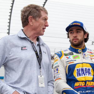 NASCAR Cup Series driver Chase Elliott (right) stands with his father and former driver Bill Elliott (left) prior to the AAA Drive for Autism at Dover International Speedway.