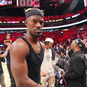 Miami Heat forward Jimmy Butler (22) walks off the court after greeting court-side friends following the victory over the San Antonio Spurs at Kaseya Center.