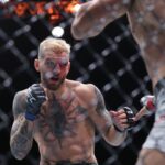 UFC DU PLESSIS ADESANYA, Mateusz Gamrot (right) of Poland and Dan Hooker of New Zealand during their Lightweight bout at UFC 305 at RAC Arena in Perth, Sunday, August 18, 2024.