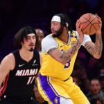 Los Angeles Lakers forward Anthony Davis (3) moves the ball against Miami Heat guard Jaime Jaquez Jr. (11) during the first half at Crypto.com Arena