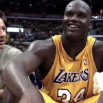 Laker center Shaquille O'Neal sits next to \"X-Files\" star David Duchovny after being taken out of the games in the 4th quarter of the 1st round NBA Playoff game at Staples Center. The Lakers won 106-83.