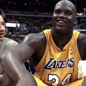 Laker center Shaquille O'Neal sits next to \"X-Files\" star David Duchovny after being taken out of the games in the 4th quarter of the 1st round NBA Playoff game at Staples Center. The Lakers won 106-83.