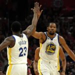 Golden State Warriors forward Kevin Durant (35) celebrates with forward Draymond Green (23) against the LA Clippers in the first half of game six of the first round of the 2019 NBA Playoffs at Staples Center.