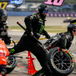 NASCAR Cup Series driver Riley Herbst’s pit crew leaps into action during the Ally 400 at Nashville Superspeedway in Lebanon, Tenn., Sunday, June 30, 2024.