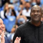 Former North Carolina Tar Heels head coach Roy Williams with former UNC great Michael Jordan on the court as they were honored as part of the 1982 national championship team in the second half at Dean E. Smith Center.