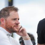 Justin Marks talks with a crew member after Trans Am practice Friday, July 7, 2023, at Road America in Elkhart Lake, Wisconsin.