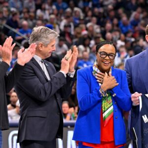 (from left) Mark Cuban and new Dallas Mavericks CEO Rick Welts and retiring Mavericks CEO Cynt Marshall and Mavericks governor Patrick Dumont present Marshall with a commerative jersey during the game between the Dallas Mavericks and the Minnesota Timberwolves at the American Airlines Center.