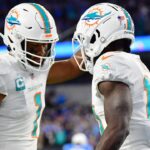 Dec 11, 2022; Inglewood, California, USA; Miami Dolphins wide receiver Tyreek Hill (10) celebrates his touchdown scored against the Los Angeles Chargers with quarterback Tua Tagovailoa (1) during the first half at SoFi Stadium.