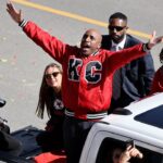 Kansas City mayor Quinton Lucas celebrates with fans in the parade during the celebration of the Kansas City Chiefs winning Super Bowl LVIII.