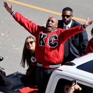 Kansas City mayor Quinton Lucas celebrates with fans in the parade during the celebration of the Kansas City Chiefs winning Super Bowl LVIII.