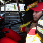 Jul 13, 2024; Long Pond, Pennsylvania, USA; NASCAR Cup Series driver Joey Logano sits in his car on pit road during practice and qualifying for the The Great American Getaway 400 at Pocono Raceway. Mandatory Credit: Matthew O'Haren-Imagn Images
