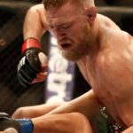 Conor McGregor (black shorts) and Max Holloway (white shorts) fight during a UFC featherweight match at the TD Garden. McGregor won after three rounds by judges decision.