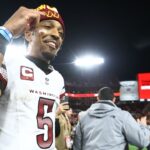 Washington Commanders quarterback Jayden Daniels (5) celebrates after winning a NFC wild card playoff against the Tampa Bay Buccaneers at Raymond James Stadium.