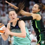 Minnesota Lynx forward Napheesa Collier (24) defends against New York Liberty forward Breanna Stewart (30) during the second half of game three of the 2024 WNBA Finals at Target Center.