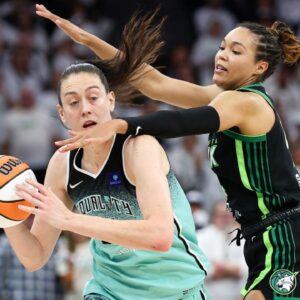 Minnesota Lynx forward Napheesa Collier (24) defends against New York Liberty forward Breanna Stewart (30) during the second half of game three of the 2024 WNBA Finals at Target Center.