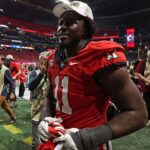 Georgia Bulldogs linebacker Jalon Walker (11) reacts after defeating the Texas Longhorns in overtime in the 2024 SEC Championship game at Mercedes-Benz Stadium.