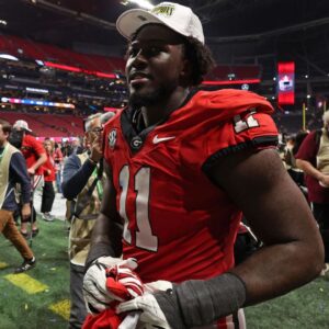 Georgia Bulldogs linebacker Jalon Walker (11) reacts after defeating the Texas Longhorns in overtime in the 2024 SEC Championship game at Mercedes-Benz Stadium.