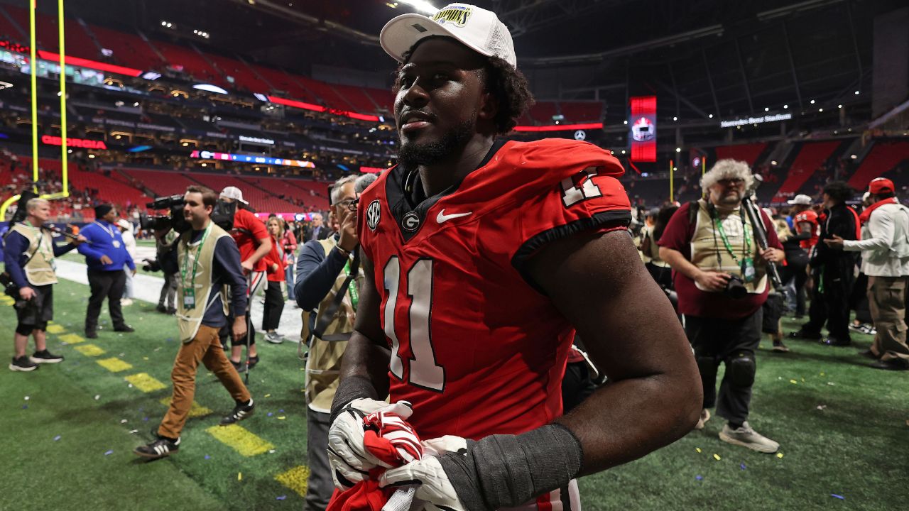 Georgia Bulldogs linebacker Jalon Walker (11) reacts after defeating the Texas Longhorns in overtime in the 2024 SEC Championship game at Mercedes-Benz Stadium.