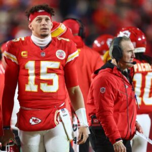 Kansas City Chiefs quarterback Patrick Mahomes (15) stands on the sidelines against the Buffalo Bills during the first half in the AFC Championship game at GEHA Field at Arrowhead Stadium.