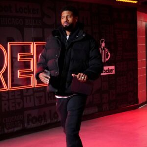 Philadelphia 76ers forward Paul George (8) walks into the United Center before the game against the Chicago Bulls.