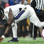 Jan 19, 2025; Orchard Park, New York, USA; Baltimore Ravens quarterback Lamar Jackson (8) fumbles the ball during the second quarter against the Buffalo Bills in a 2025 AFC divisional round game at Highmark Stadium.