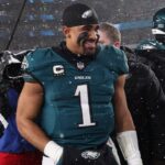 Jan 19, 2025; Philadelphia, Pennsylvania, USA; Philadelphia Eagles quarterback Jalen Hurts (1) walks off the field after defeating the Los Angeles Rams in a 2025 NFC divisional round game at Lincoln Financial Field.