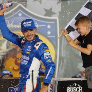 NASCAR Cup Series driver Kyle Larson (5) and his son Owen after winning the Bass Pro Shops Night Race at Bristol Motor Speedway.