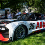 CHICAGO, IL - JULY 06: A prototype of an electric vehicle from NASCAR sits on the lawn during the NASCAR Xfinity Series The Loop 110 at the Chicago Street Course on July 06, 2024 in Chicago, Illinois. (Photo by Ben Hsu Icon Sportswire) AUTO: JUL 06 NASCAR Xfinity Series The Loop 110 EDITORIAL USE ONLY Icon224240619003