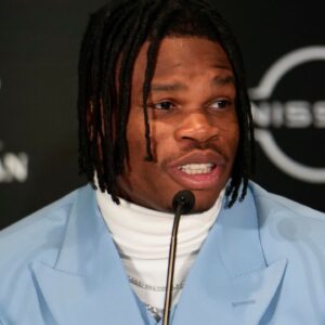 Colorado Buffaloes wide receiver/cornerback Travis Hunter speaks on stage during a press conference before the 2024 Heisman Trophy Presentation.