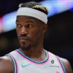 Miami Heat forward Jimmy Butler (22) looks on against the Denver Nuggets during the third quarter at Kaseya Center.