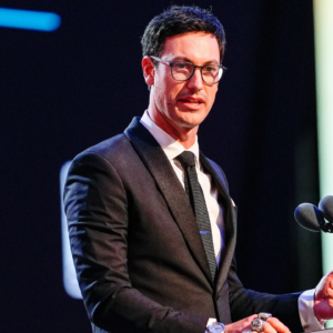 NASCAR Cup Series driver Joey Logano (22) talks to the audience after being announced as the three time Cup champion during the NASCAR Awards Banquet at Charlotte Convention Center.