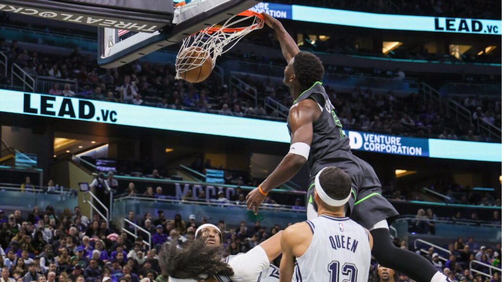 Minnesota Timberwolves guard Anthony Edwards (5) dunks during the second half against the Orlando Magic at Kia Center.