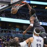Minnesota Timberwolves guard Anthony Edwards (5) dunks during the second half against the Orlando Magic at Kia Center.