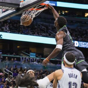 Minnesota Timberwolves guard Anthony Edwards (5) dunks during the second half against the Orlando Magic at Kia Center.
