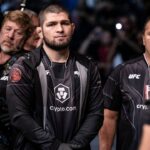Khabib Nurmagomedov is seen before the fight between Abubakar Nurmagomedov (red gloves) and Gadzhi Omargadzhiev (blue gloves) during UFC 280 at Etihad Arena.
