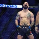 Mike Perry (blue gloves) reacts before a bout against Geoff Neal (not pictured) during UFC 245 at T-Mobile Arena.