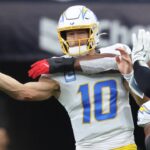 Jan 11, 2025; Houston, Texas, USA; Los Angeles Chargers quarterback Justin Herbert (10) passes during the second quarter against the Houston Texans in an AFC wild card game at NRG Stadium.