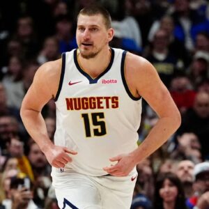Denver Nuggets center Nikola Jokic (15) reacts back to the bench after scoring on his own rebounded ball in the second half against the Atlanta Hawks at Ball Arena.