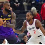 Los Angeles Lakers forward LeBron James (23) moves the ball against Los Angeles Clippers forward Kawhi Leonard (2) during the first half at Intuit Dome.