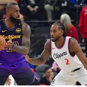 Los Angeles Lakers forward LeBron James (23) moves the ball against Los Angeles Clippers forward Kawhi Leonard (2) during the first half at Intuit Dome.