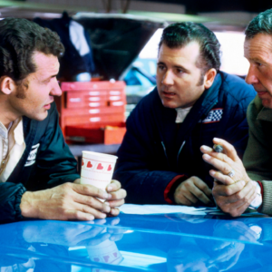 Feb 1, 1969; Riverside, CA, USA; FILE PHOTO; NASCAR Grand National Series driver Richard Petty (left), Lee Roy Yarbrough (center), and Lee Petty (right) talk in the garage at the 1969 Motor Trend 500 at Riverside International Speedway. Mandatory Credit: Darryl Norenberg-Imagn Images