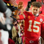 Kansas City Chiefs quarterback Patrick Mahomes (15) shakes hands with fans after defeating the Houston Texans in a 2025 AFC divisional round game at GEHA Field at Arrowhead Stadium.
